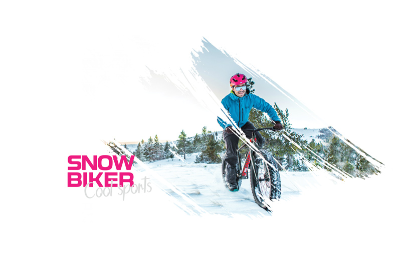A cyclist riding a fat-tire bike across a snow-covered trail.